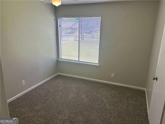 8922 Gatewood Cir, Jonesboro, GA 30238 - carpeted spare room featuring baseboards and a ceiling fan