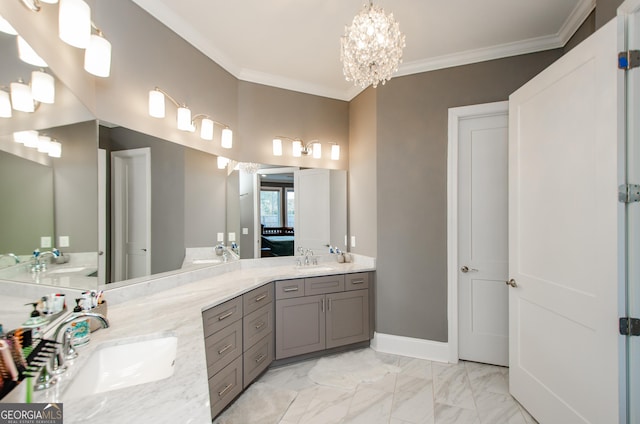 bathroom featuring a sink, an inviting chandelier, and double vanity