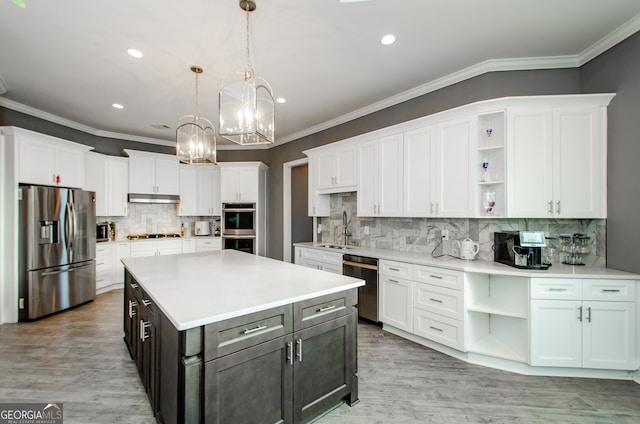 kitchen featuring appliances with stainless steel finishes, open shelves, and white cabinetry