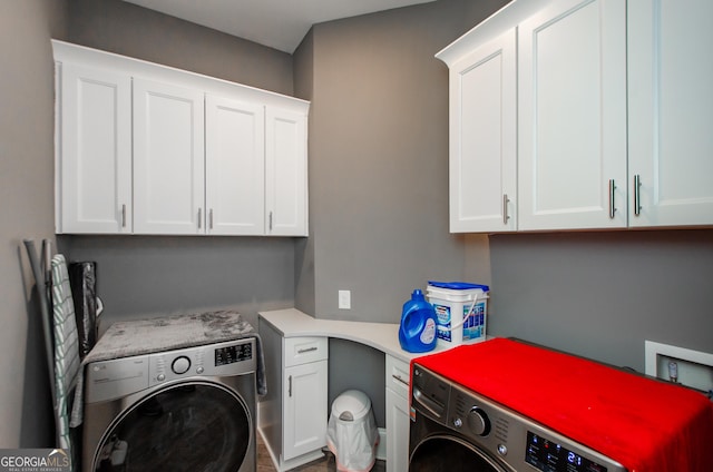 laundry room with cabinet space and washer and dryer