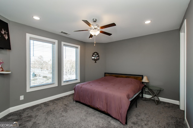 bedroom with baseboards, carpet, a ceiling fan, and visible vents