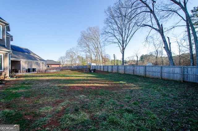 view of yard with a fenced backyard