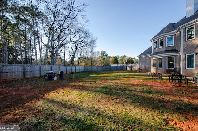 view of yard with a fenced backyard