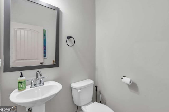 3493 Monarch Ave, Duluth, GA 30096 - half bathroom with a sink and toilet