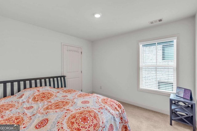 3493 Monarch Ave, Duluth, GA 30096 - bedroom with baseboards, visible vents, and light carpet