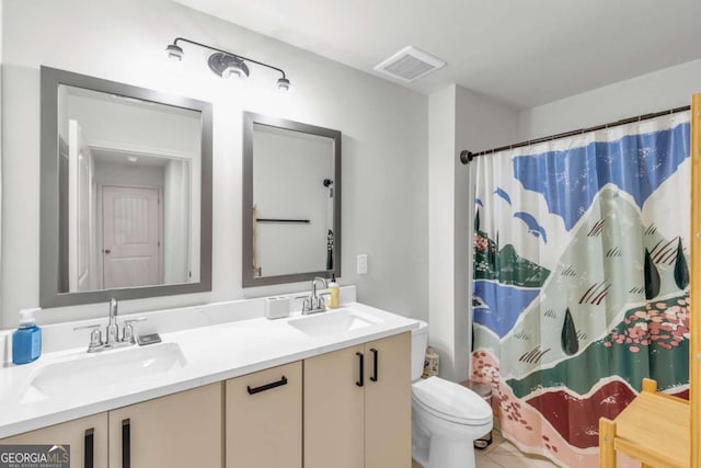 3493 Monarch Ave, Duluth, GA 30096 - bathroom with a sink, toilet, double vanity, and visible vents