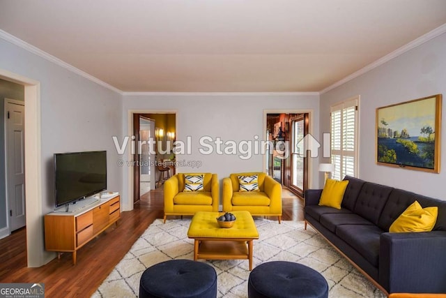 living area with baseboards, ornamental molding, and wood finished floors