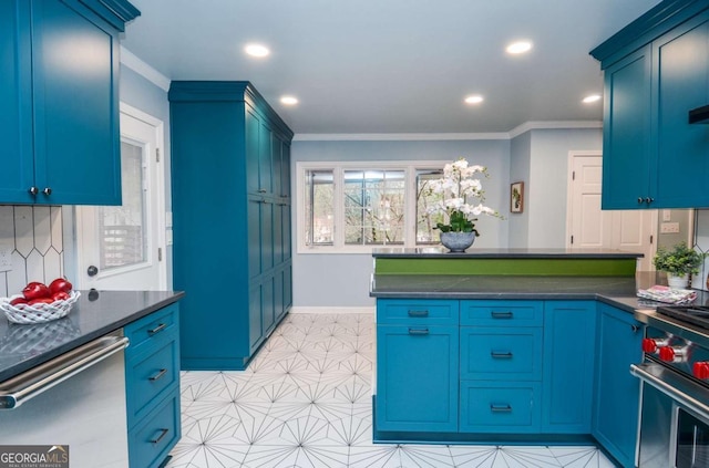 kitchen featuring crown molding, dark countertops, a peninsula, and appliances with stainless steel finishes