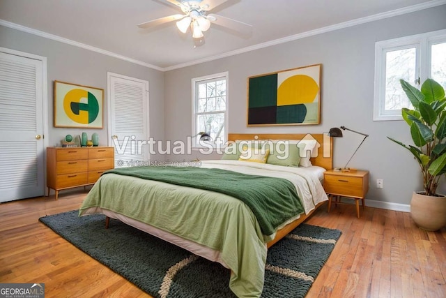 bedroom featuring baseboards, ornamental molding, wood-type flooring, and a ceiling fan