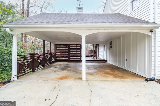 view of car parking with concrete driveway and an attached carport