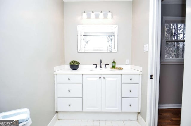 bathroom featuring baseboards and vanity
