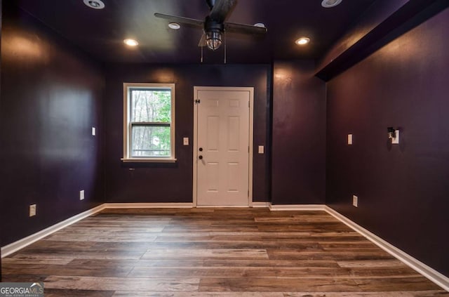 foyer entrance featuring a ceiling fan, baseboards, recessed lighting, and wood finished floors