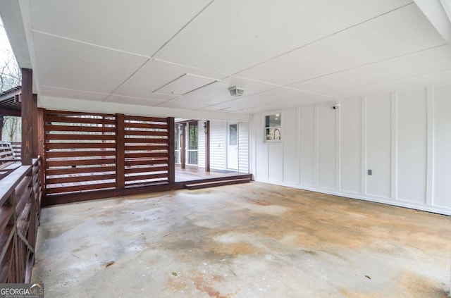 interior space featuring concrete flooring and a wealth of natural light