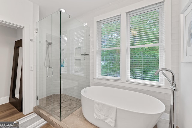 1010F Tailwater, Greensboro, GA 30642 - bathroom with a freestanding tub, a healthy amount of sunlight, and a shower stall