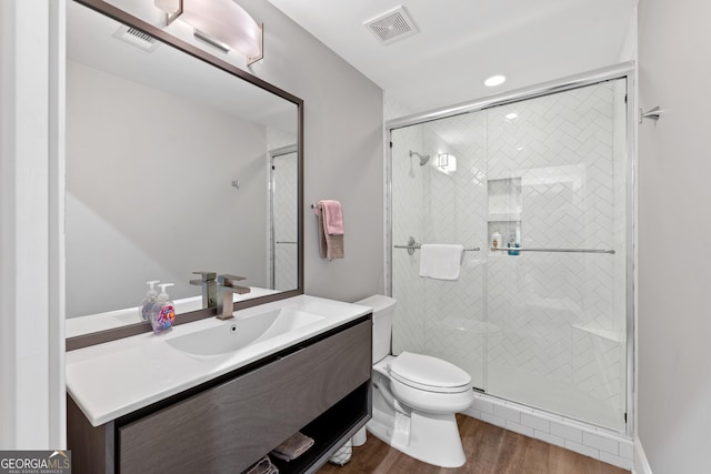 1010F Tailwater, Greensboro, GA 30642 - full bath featuring toilet, visible vents, wood finished floors, and a stall shower