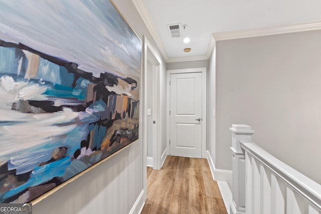 1010F Tailwater, Greensboro, GA 30642 - corridor with crown molding, light wood finished floors, baseboards, an upstairs landing, and visible vents