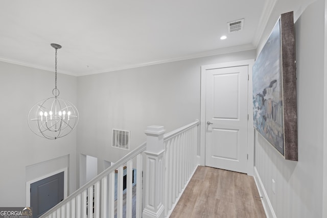 1010F Tailwater, Greensboro, GA 30642 - hallway with visible vents, ornamental molding, light wood finished floors, and an upstairs landing