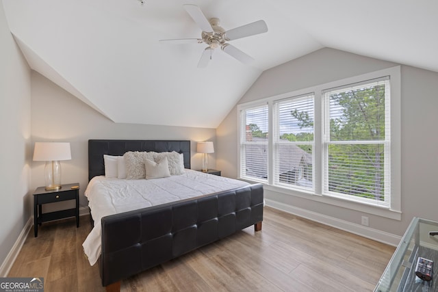 1010F Tailwater, Greensboro, GA 30642 - bedroom featuring baseboards, a ceiling fan, vaulted ceiling, and wood finished floors