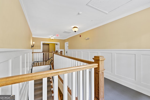 1010F Tailwater, Greensboro, GA 30642 - corridor featuring crown molding, carpet flooring, wainscoting, a decorative wall, and an upstairs landing