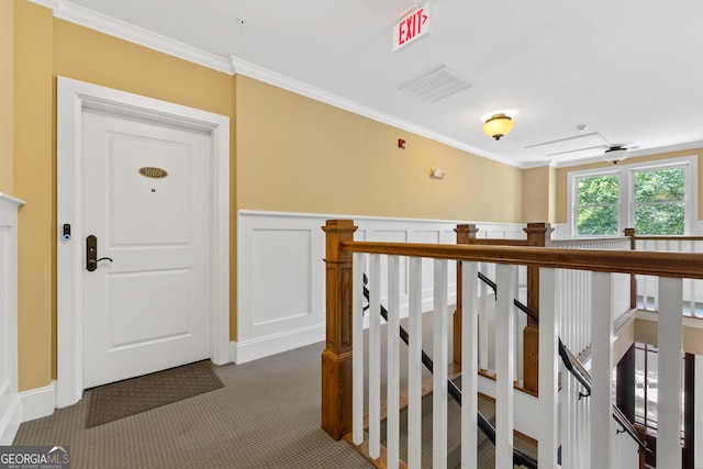 1010F Tailwater, Greensboro, GA 30642 - corridor with wainscoting, ornamental molding, carpet flooring, and an upstairs landing