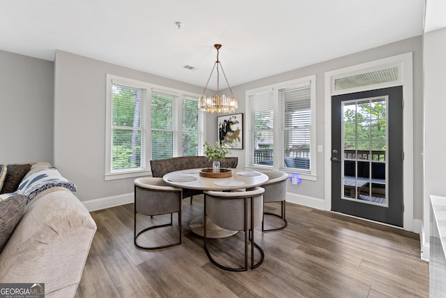1010F Tailwater, Greensboro, GA 30642 - dining room with an inviting chandelier, breakfast area, baseboards, wood finished floors, and visible vents