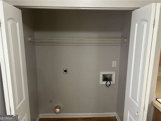 clothes washing area featuring laundry area, gas dryer hookup, electric dryer hookup, baseboards, and hookup for a washing machine