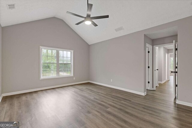 470 Brackin Trce, Grayson, GA 30017 - spare room with ceiling fan, visible vents, baseboards, dark wood-style floors, and lofted ceiling
