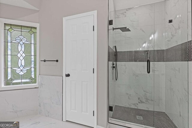 470 Brackin Trce, Grayson, GA 30017 - bathroom featuring a shower stall and marble finish floor