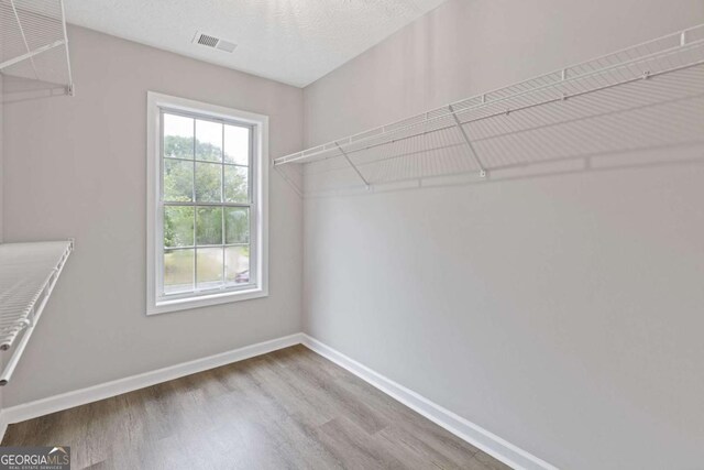 470 Brackin Trce, Grayson, GA 30017 - walk in closet with wood finished floors and visible vents