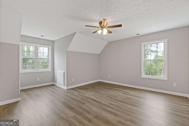 470 Brackin Trce, Grayson, GA 30017 - additional living space featuring baseboards, ceiling fan, wood finished floors, and a healthy amount of sunlight