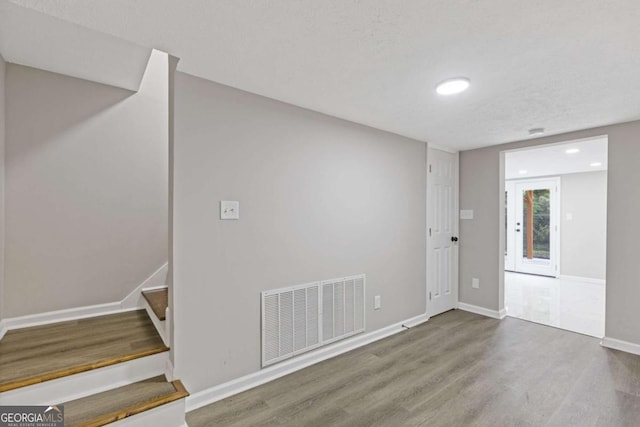 470 Brackin Trce, Grayson, GA 30017 - empty room featuring wood finished floors and stairs