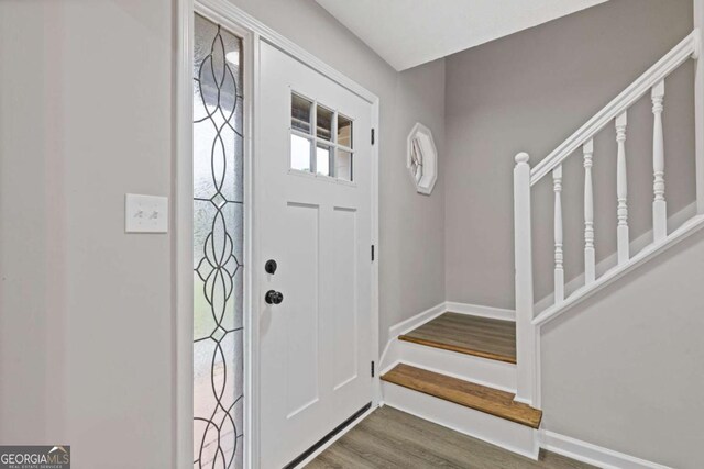 470 Brackin Trce, Grayson, GA 30017 - foyer featuring baseboards, stairs, and wood finished floors