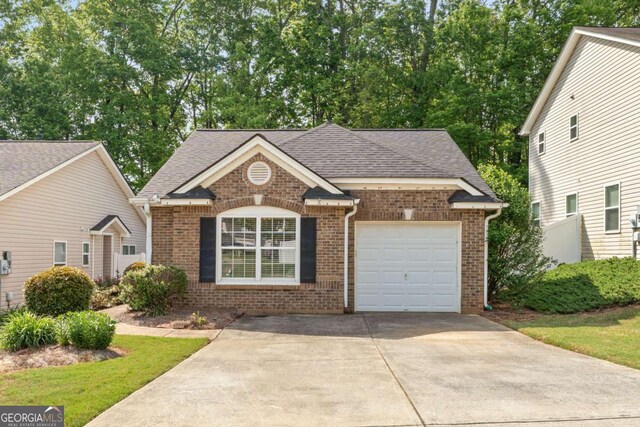 171 Nacoochee Way, Canton, GA 30114 - view of front of property featuring brick siding, concrete driveway, an attached garage, and a shingled roof