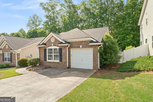 171 Nacoochee Way, Canton, GA 30114 - view of front of property featuring an attached garage, concrete driveway, brick siding, and roof with shingles
