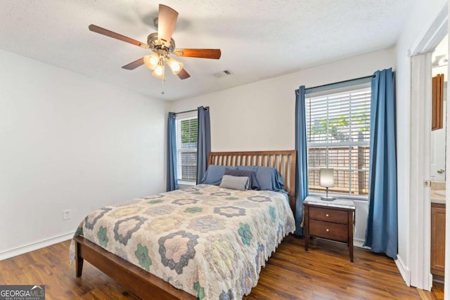 171 Nacoochee Way, Canton, GA 30114 - bedroom featuring dark wood-style flooring, baseboards, a ceiling fan, and a textured ceiling