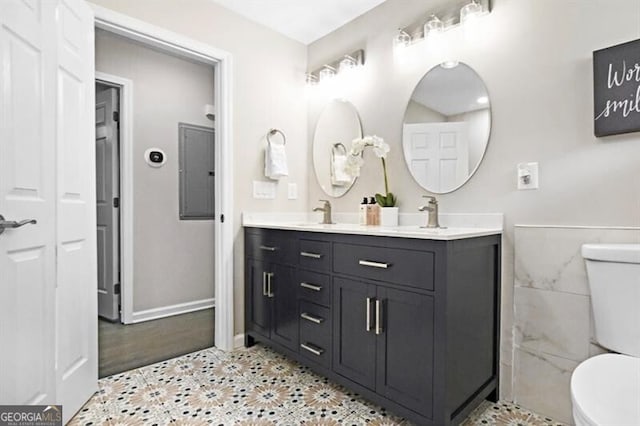 1140 Starline Dr SE, Smyrna, GA 30080 - full bath with double vanity, toilet, tile patterned floors, and a sink