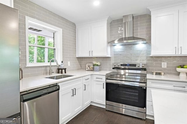 1140 Starline Dr SE, Smyrna, GA 30080 - kitchen featuring wall chimney range hood, stainless steel appliances, a sink, and light countertops