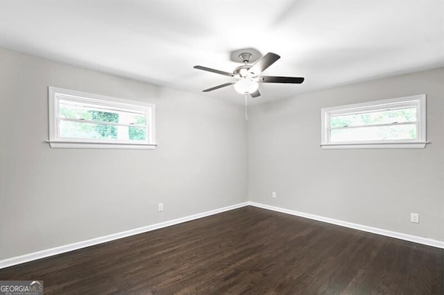1140 Starline Dr SE, Smyrna, GA 30080 - empty room featuring baseboards, dark wood finished floors, and ceiling fan