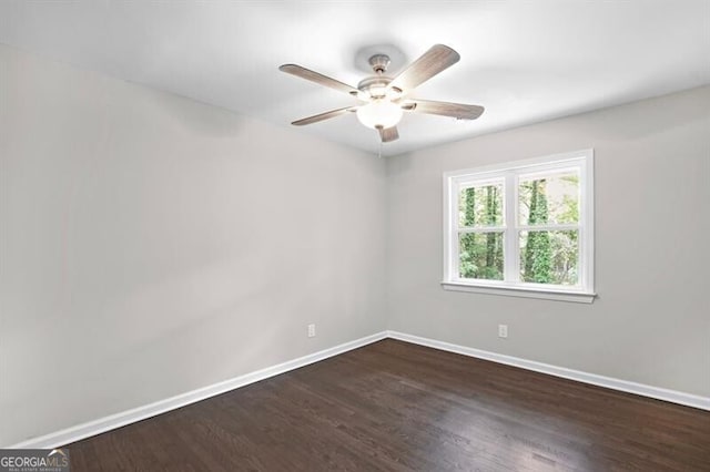 1140 Starline Dr SE, Smyrna, GA 30080 - empty room with dark wood-style flooring, baseboards, and ceiling fan