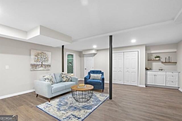 1140 Starline Dr SE, Smyrna, GA 30080 - living room featuring baseboards, recessed lighting, bar, and wood finished floors
