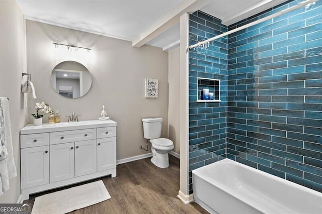1140 Starline Dr SE, Smyrna, GA 30080 - bathroom featuring vanity, wood finished floors, toilet, baseboards, and rail lighting