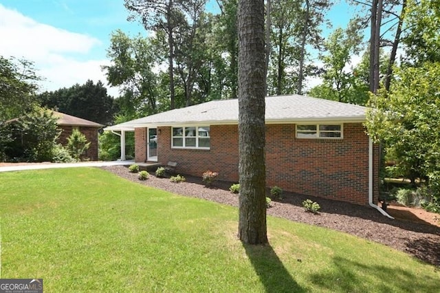 1140 Starline Dr SE, Smyrna, GA 30080 - view of front of home featuring brick siding and a front lawn