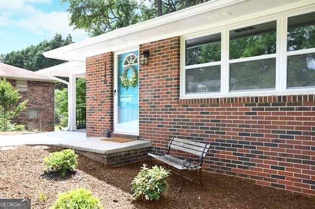 1140 Starline Dr SE, Smyrna, GA 30080 - doorway to property featuring brick siding