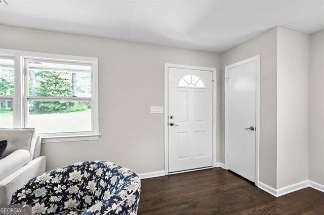1140 Starline Dr SE, Smyrna, GA 30080 - foyer with baseboards and dark wood-style flooring