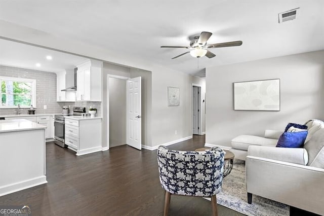 1140 Starline Dr SE, Smyrna, GA 30080 - living area featuring a ceiling fan, dark wood-style flooring, visible vents, baseboards, and recessed lighting