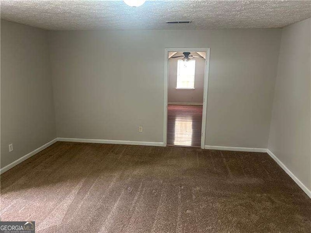 5340 Forest Pl, Stone Mountain, GA 30088 - carpeted spare room featuring a textured ceiling and ceiling fan