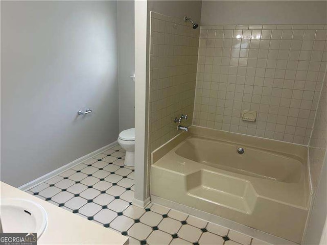 5340 Forest Pl, Stone Mountain, GA 30088 - bathroom with tile patterned floors and bathing tub / shower combination