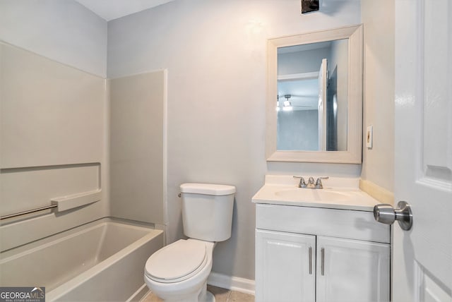 bathroom featuring vanity, baseboards, shower / bathtub combination, and toilet