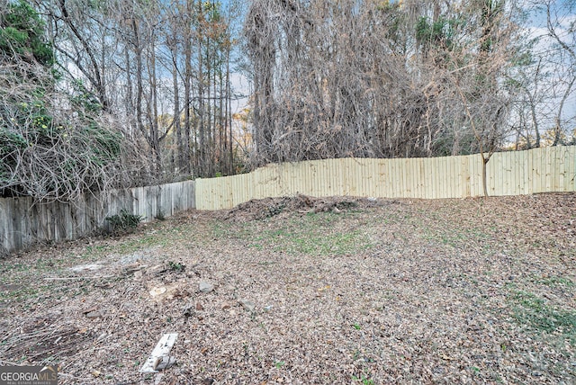 view of yard with a fenced backyard