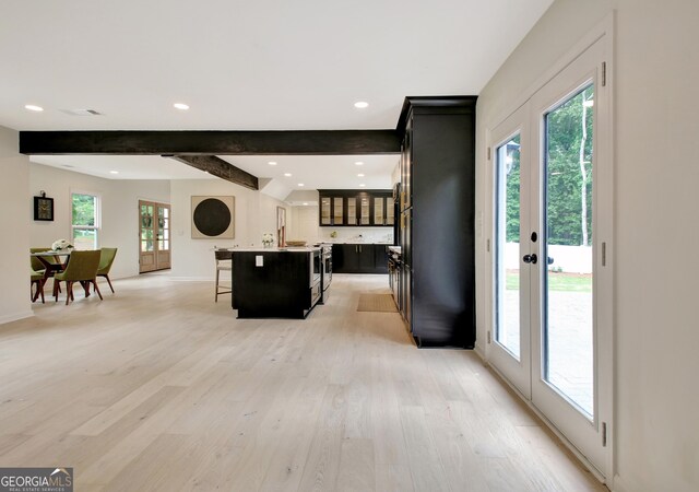 entrance foyer featuring recessed lighting, baseboards, light wood-type flooring, beamed ceiling, and visible vents